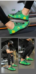 Detail of green mesh barefoot shoes with yellow maple leaf patterns and anti-slip rubber sole