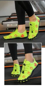 Detail of neon green water shoes with maple leaf print and anti-slip rubber sole