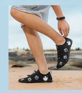 Detail of breathable mesh barefoot shoes with maple leaf print and quick-lace system