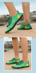 Detail of green barefoot water shoes with yellow leaf pattern and non-slip rubber sole