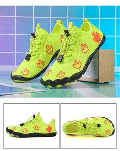 Detail view of quick-dry water shoes with neon green mesh and non-slip rubber soles