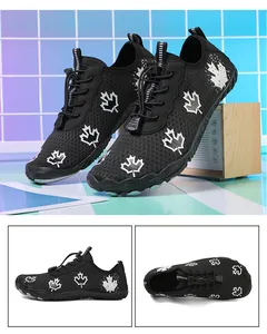 Close-up of black quick-dry water shoes featuring mesh upper and maple leaf pattern