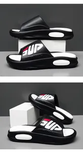 Detail of men's athletic slide with thick cushioned sole and massage footbed texture