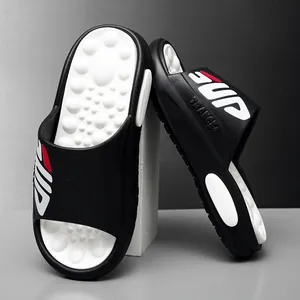 Men's black and white EVA slippers with massage footbed and red SUP logo lettering