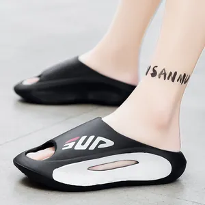 Sporty black and white platform slide sandals with thick sole and street style design