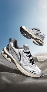 Detailed macro view of silver running shoes with breathable mesh and shock-absorbing sole