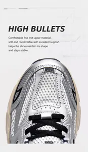 Detail showing breathable mesh fabric and synthetic leather on a silver sports shoe