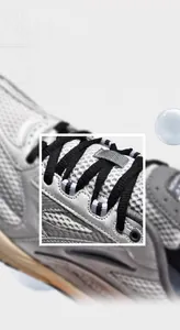Macro view of tight woven black laces and breathable white mesh on retro sneakers
