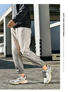 Detail of silver-white running shoes with breathable mesh and shock rebound sole technology