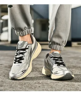 Detail view of silver breathable mesh sneakers with chunky anti-slip soles for men