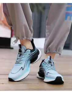 On-foot shot of lightweight breathable mesh sneakers with gradient blue and black design