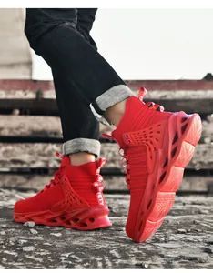 Action shot of red high-top safety shoes with shock-absorbing soles on industrial stairs