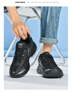 Detail of black breathable mesh running sneakers with silver reflective curved lines