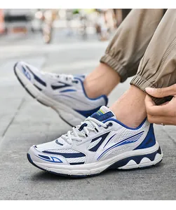 Detail of retro mesh sneakers showing blue streamline patterns and thick anti-slip sole