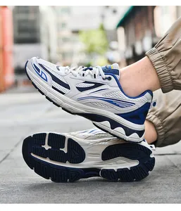 Detail of white and blue mesh sneakers showing the breathable upper and anti-slip sole