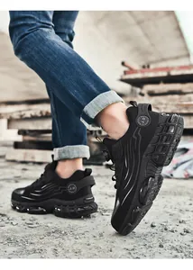 Detail of safety shoe featuring breathable mesh, shock-absorbing sole, and anti-puncture steel toe