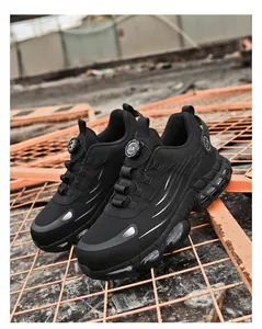 Outdoor close-up of black steel toe safety shoes with air cushion and knob lacing system