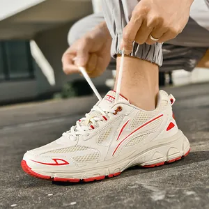 Men's casual sneakers with cream mesh, red accents, and anti-slip rubber soles for outdoor