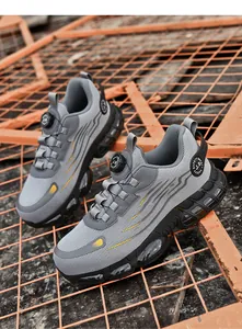 Close-up of safety shoes featuring a quick-dial lacing system and cushioned sole design