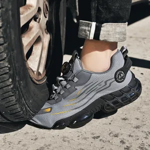 Grey steel toe safety shoe with rotary buckle resisting tire pressure for protection