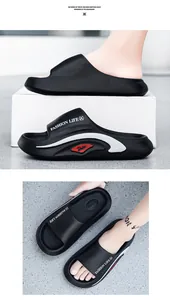Detail view of black EVA sandals showing non-slip footbed and Fashion Life logo print