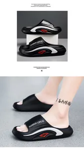 Detail view of black EVA slides with white wave patterns and Fashion Life text
