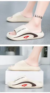 Close-up of EVA thick-sole slide with Fashion Life print and brown wave side detail