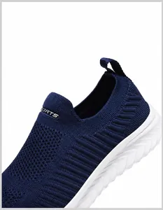 Detailed close-up of dark blue breathable knit fabric and Sports logo on slip-on sneaker