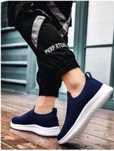 Detail shot of breathable deep blue mesh walking shoe with flexible white wavy sole
