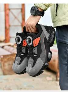 Detailed view of safety shoes featuring rotary buckle system and steel toe protection