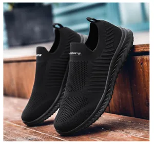 Detailed macro view of breathable knitted fabric and slip-on design on black sports shoes