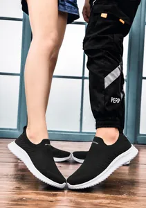 Detail shot of breathable slip-on sports shoes with thick anti-slip white rubber soles