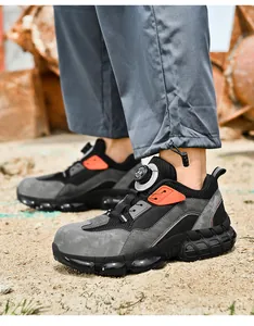 Macro view of safety shoe with rotating lace system on durable mesh and suede upper