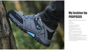 Detail of outdoor hiking shoes with grey suede, breathable mesh and blue non-slip rubber sole