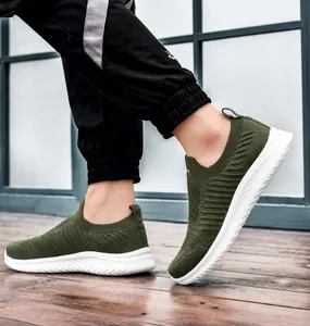 Breathable olive green knit sock sneaker featuring a white chunky cushioned sole for men