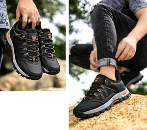 Detailansicht schwarzer Outdoor-Wanderschuhe mit verstärkter Zehenkappe und orangen Akzenten