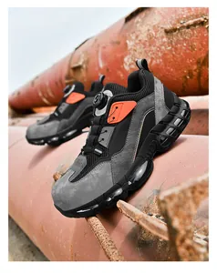 Detail of safety shoe with rotating lace system and puncture resistant steel toe cap