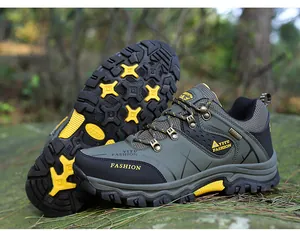 Detail of outdoor hiking shoes featuring durable non-slip rubber soles and mesh fabric