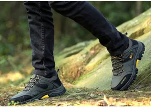 Deep-grooved non-slip sole of army green outdoor hiking shoes on forest terrain