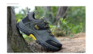 Close-up of military green outdoor hiking shoes with anti-slip MD sole in forest