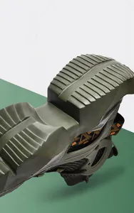 Detailed macro view of the olive green textured outsole with deep grip patterns