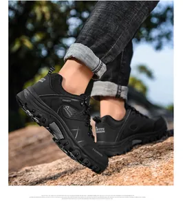 Close-up of durable lugged rubber outsole for outdoor hiking shoes on rocky terrain