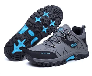 Macro detail of men's hiking shoes showing anti-slip rubber outsole and mesh texture