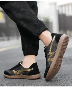 Detail of retro sneakers with gold lightning logo and anti-slip gum rubber sole