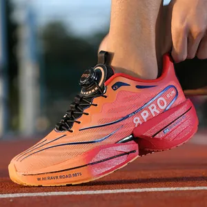 Breathable running shoes with gradient orange mesh and 8PRO knob closure on track