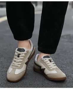 Detail of khaki suede toe and gum rubber sole on vintage style casual sneakers
