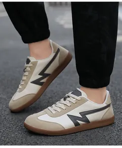 Close-up of retro trainer shoe showing suede panels and durable gum rubber outsole