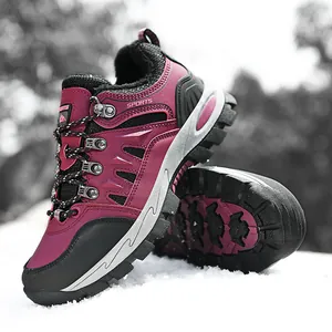 Burgundy high-top hiking boots with warm fleece lining on a snowy outdoor background