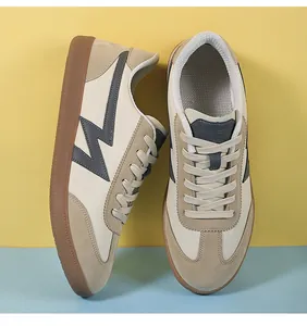 Detail of GAT sneakers featuring beige leather, suede panels and retro gum rubber outsoles