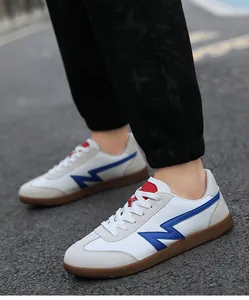 Macro shot of retro unisex trainer with blue logo patch and vintage rubber outsole
